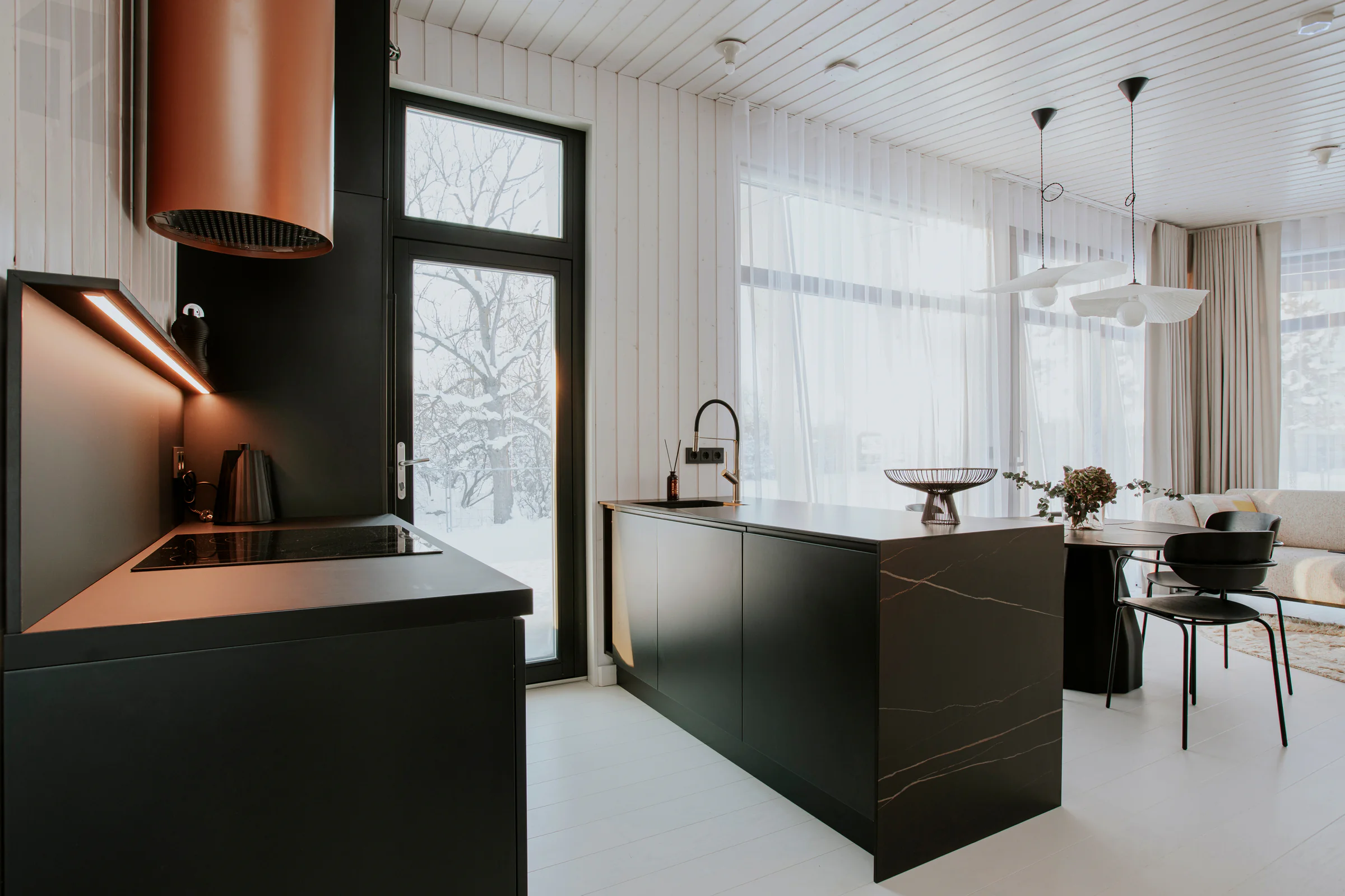Kitchen remodel detail with cabinetry, island counter, fixtures, and finish planning